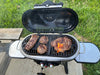 Gridiron Outdoor Tailgate 205 Dual Burner Portable Gas Grill open with food